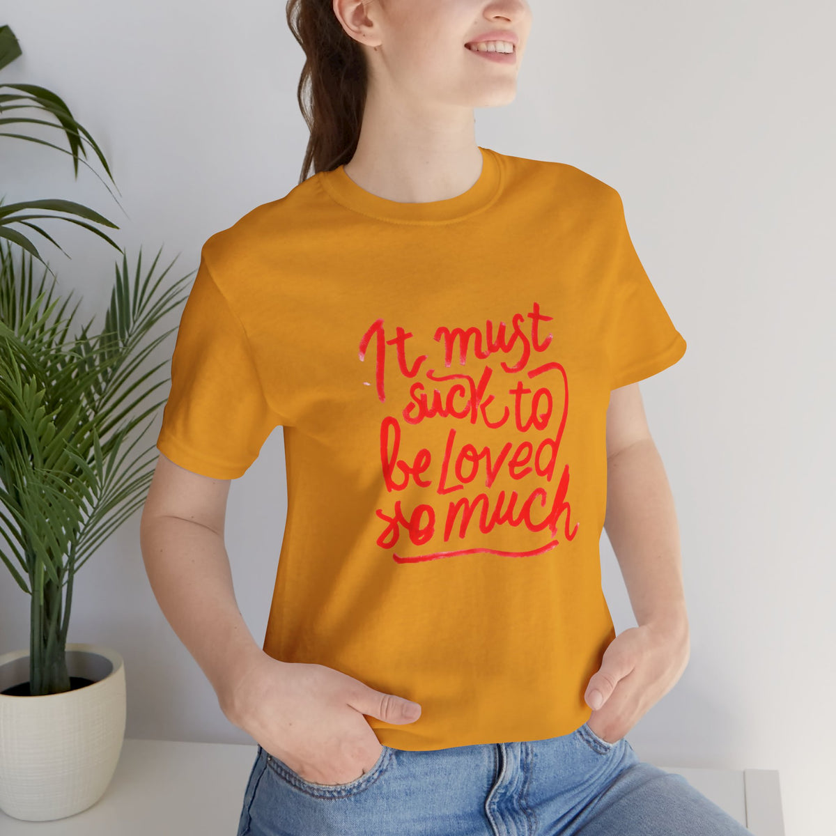 T‑Shirt — “It Must Suck to Be Loved So Much” Red Script Tee