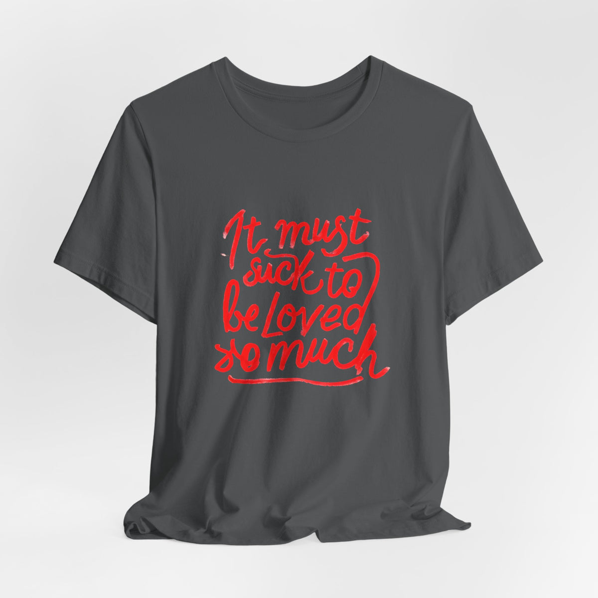 T‑Shirt — “It Must Suck to Be Loved So Much” Red Script Tee