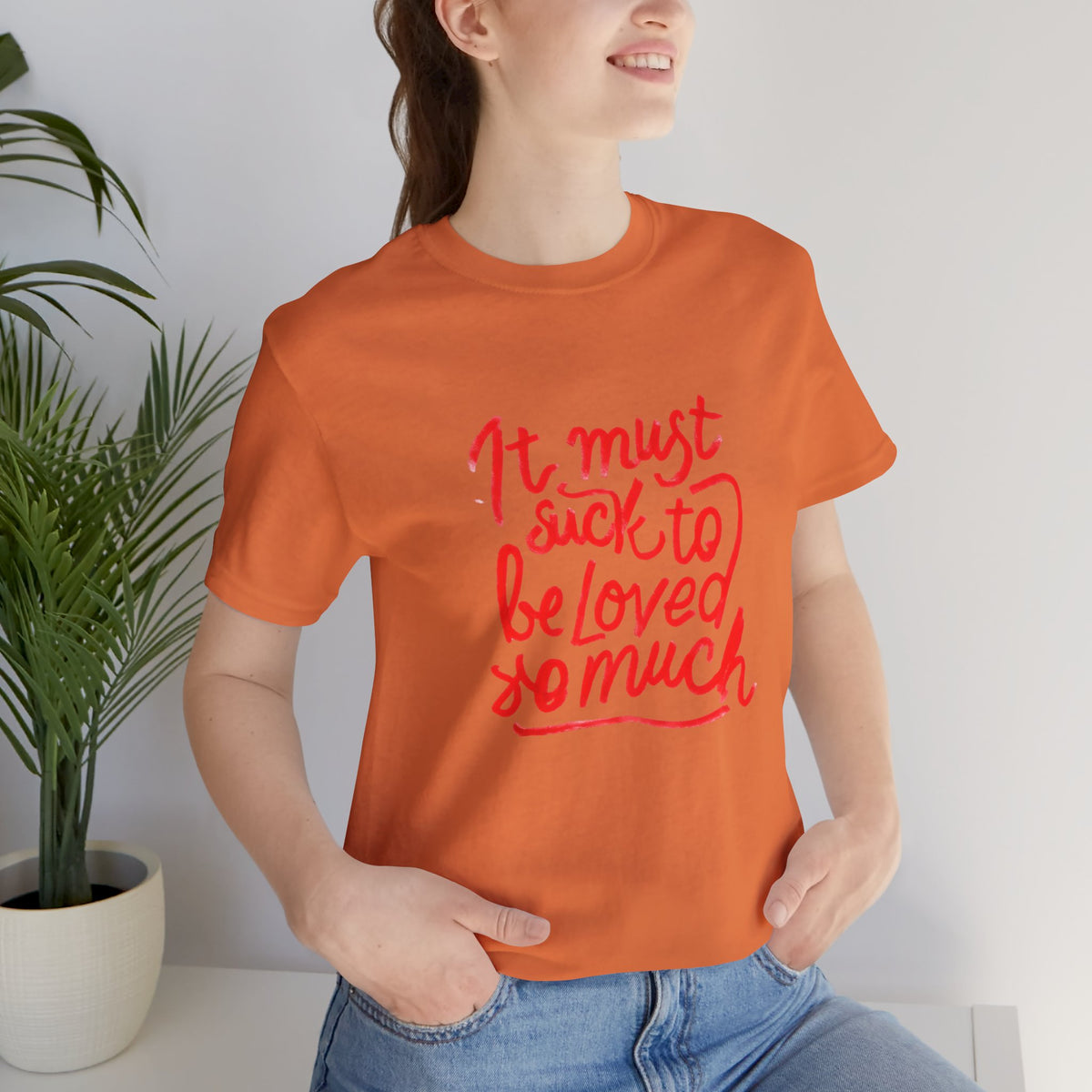T‑Shirt — “It Must Suck to Be Loved So Much” Red Script Tee