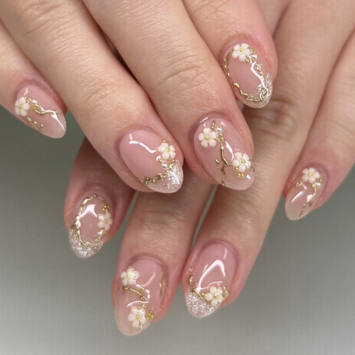 Soft Pink Floral Almond Nails with Gold Details
