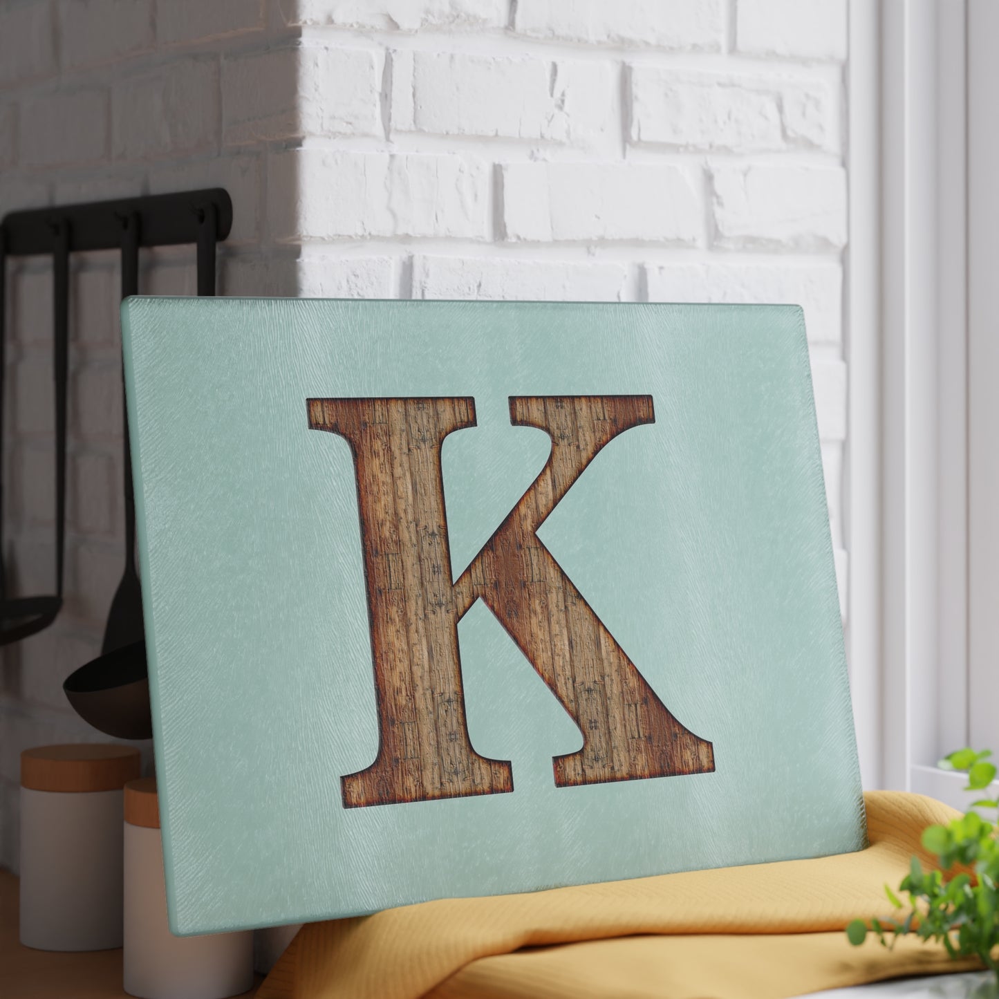 Monogram 'K' Glass Cutting Board — Rustic Wood Letter on Mint Background