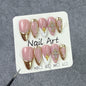 Elegant Gold Frame Blush Nails with Chic Cross Accents – Image 2