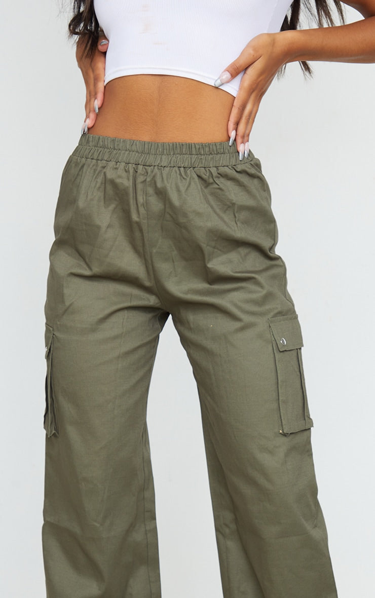 https://cdn-img.prettylittlething.com/9/b/f/a/9bfaf0770d8cc13b1c74194e33948bd697f5b559_CMO6593_4_khaki_wide_leg_high_waisted_cargo_trousers.jpg