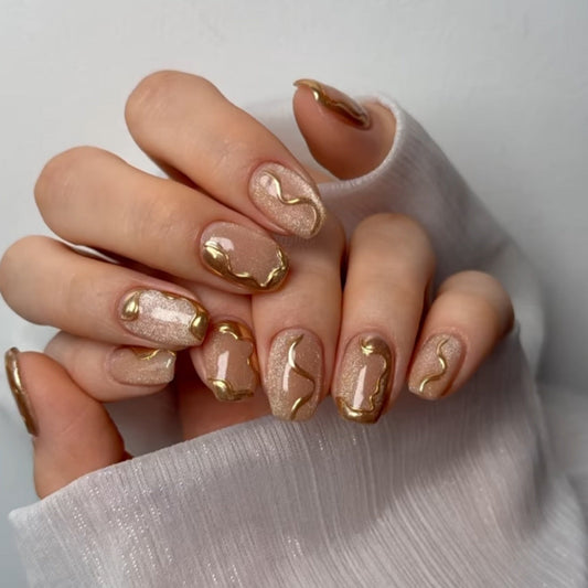 Golden Swirl Nude Nails with Shimmer Gloss Finish